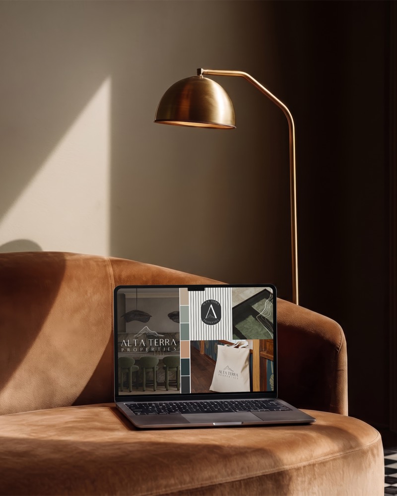 Alta Terra Properties brand identity on a laptop